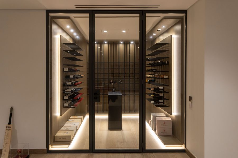 Glass-fronted wine cellar with oak lining — Villa Arade, Quinta do Lago