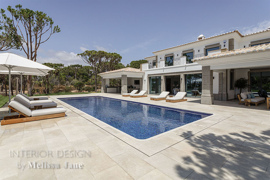 Villa swimming pool and terrace with loungers