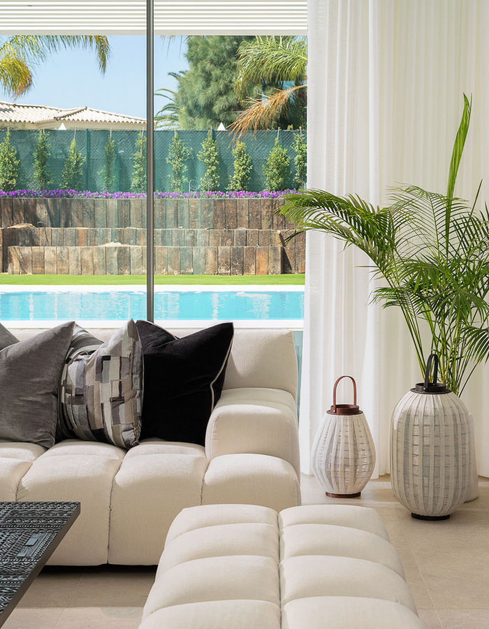 Lounge seating opening onto a pool terrace in the Algarve