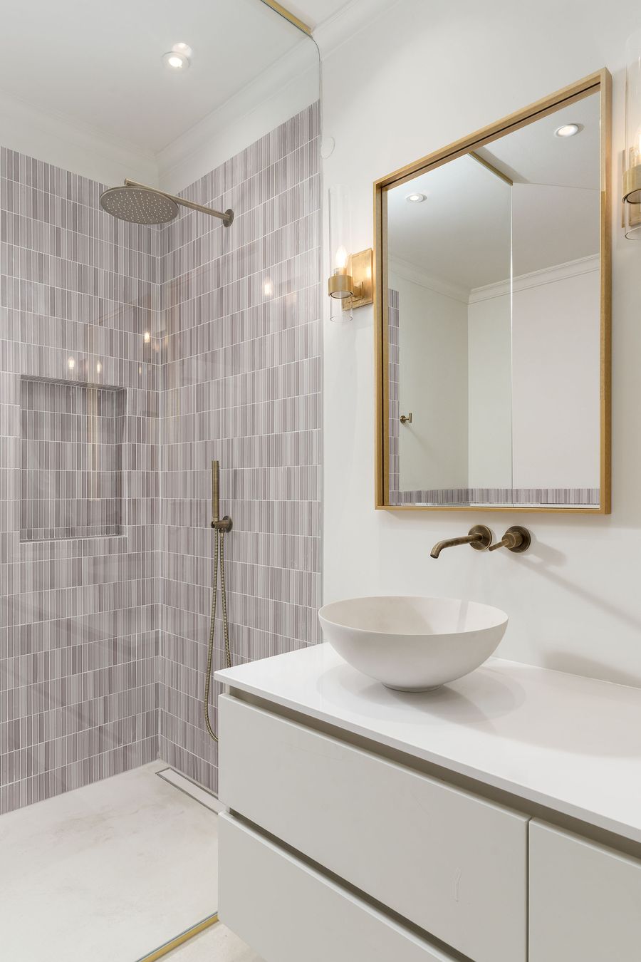Lilac-tiled shower with brass-framed mirror — Martinhal, Quinta do Lago