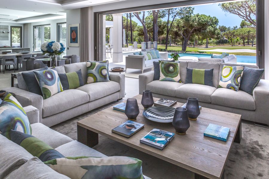 Living room with grey sofas and pool and golf views — Villa Arade, Quinta do Lago